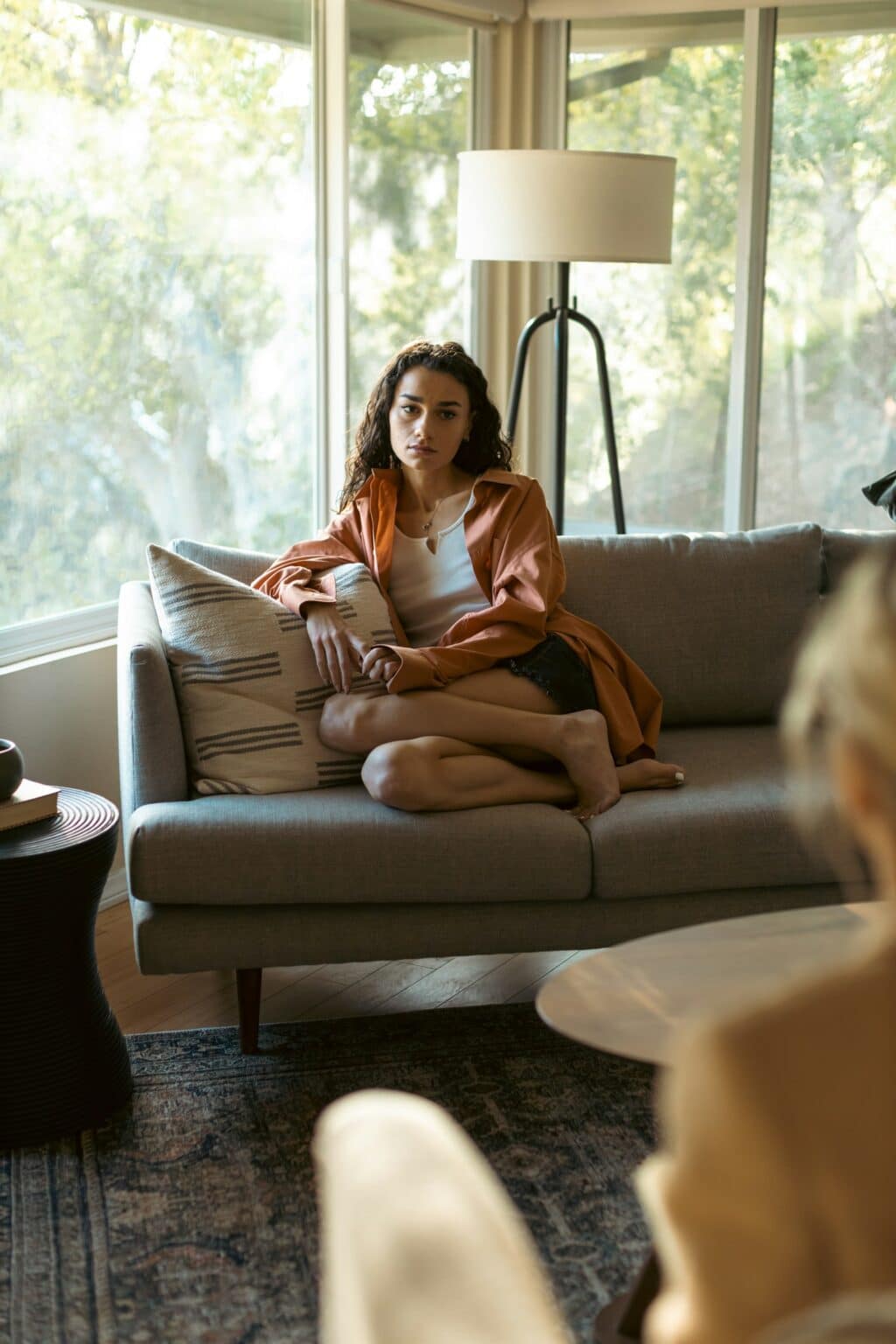a woman sitting on a couch for therapy