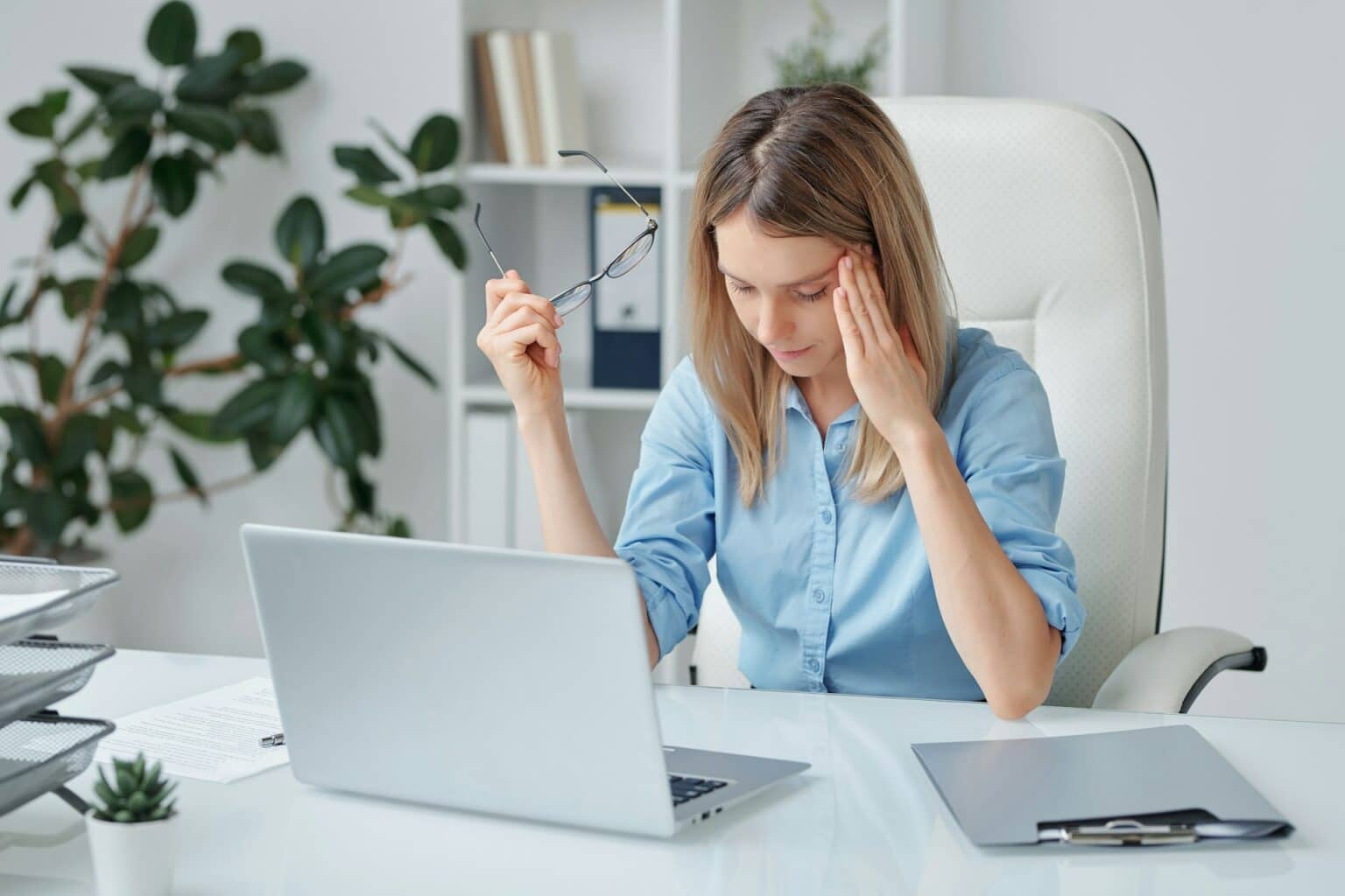 A confident asian woman wearing white polo at home