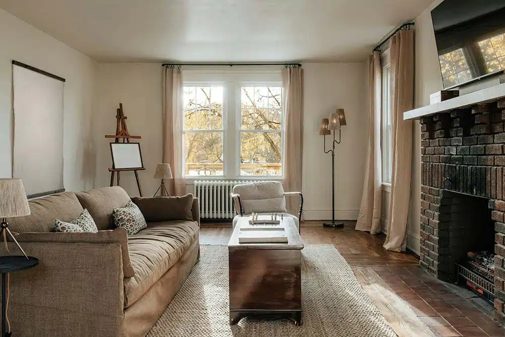 a living room filled with furniture and a fire place