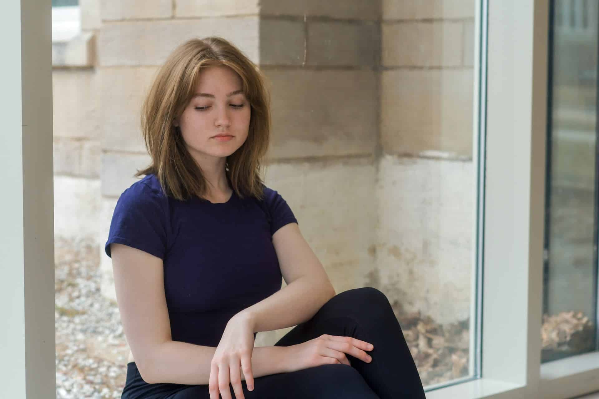 a woman sitting on a couch for therapy