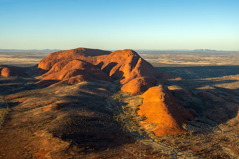 red desert landscape with large rock formations